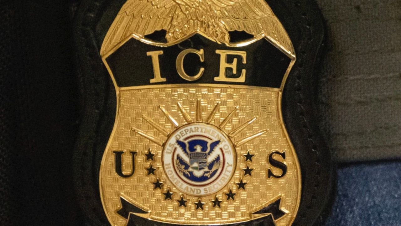 A federal agent wears an Immigration and Customs Enforcement badge in New York, June 10, 2025. (AP Photo/Yuki Iwamura)