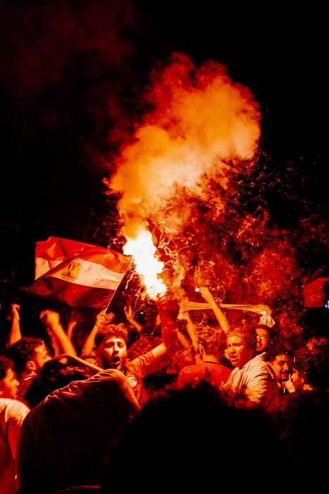 Egypt fans celebrate after their country's 1-1 tie with Iran in the World Cup.