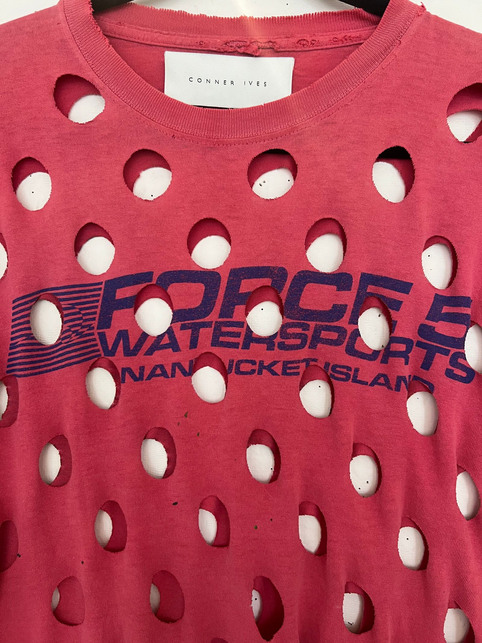 Image may contain Pattern Clothing TShirt Shirt and Toy