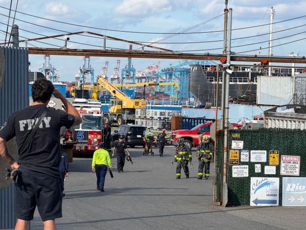 Emergency workers are pictured after an explosion on a barge on Staten Island, killing one man and igniting a blaze that injured two firefighters, at the yard on Richmond Terrace near South Ave. in Mariners Harbor Thursday, Sept. 10, 2026. (Rose Abuin / New York Daily News)