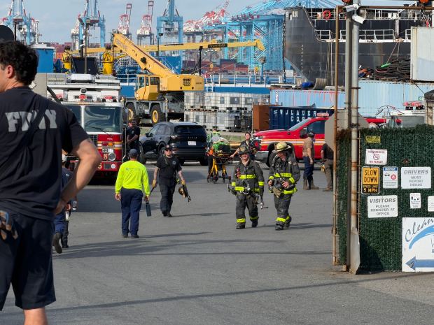 Emergency workers are pictured after an explosion on a barge on Staten Island, killing one man and igniting a blaze that injured two firefighters, at the yard on Richmond Terrace near South Ave. in Mariners Harbor Thursday, Sept. 10, 2026. (Rose Abuin / New York Daily News)