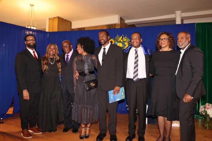 Family members on stage after the funeral service.