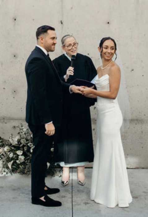 two people getting married as a judge officiates