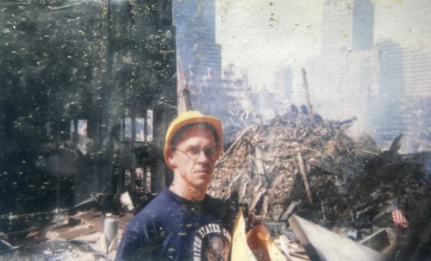 Mike Keane is pictured on the bar roof with the pile behind him the week after 9/11. (Courtesy of Mike Keane)