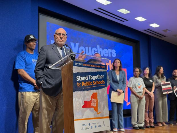 State Assemblyman and Education Committee Chair Michael Benedetto speaks as teachers union reps, elected officials, civil rights groups and education advocates rally at the United Federation of Teachers headquarters Wednesday, Sept. 16, 2026, to urge Gov. Hochul to opt out of a Republican-led federal tax credit scholarship program. (Cayla Bamberger / New York Daily News)