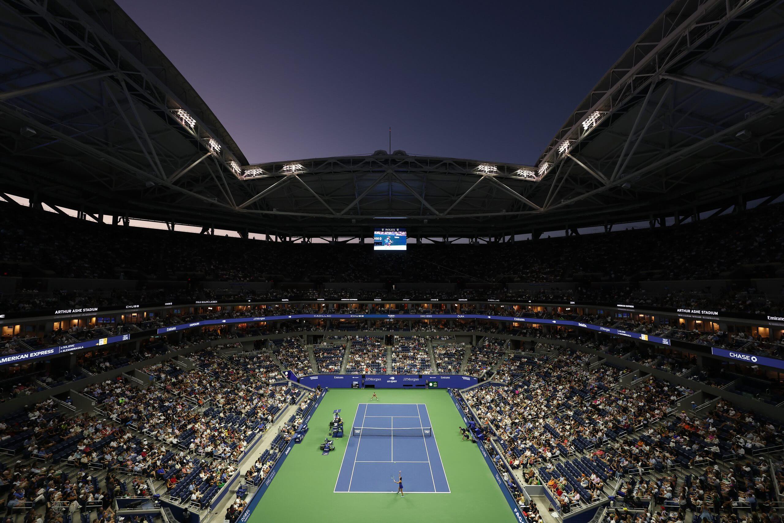 Alex Eala and Iva Jović stand on Arthur Ashe Stadium, seen in a general view that takes in the whole bowl.