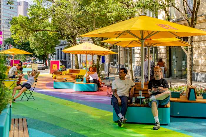 people sitting in an outdoor plaza