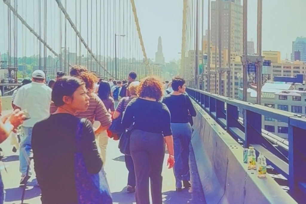 Photojournalist Joe DiPetro took this photo from the Manhattan Bridge as he and thousands of other people walked across the bridge in an effort to get home after the Twin Towers in New York City had fallen on the morning of Sept. 11, 2001. (Photo by Joe DiPetro)
