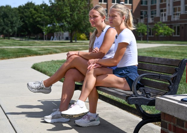 Miami University student Anna Rasmusson, left, Katie VandeWyngearde, both 20, talk about the Sept. 11 terrorist attacks as they sit on a bench dedicated to Kelly Booms in Oxford, OH, on Tuesday, September 8, 2026. Booms, 24, was a graduate of the university and aboard American Airlines Flight 11 when it was crashed in to the North Tower of the World Trade Center. (Photo by Jeff Gritchen, Orange County Register/SCNG)