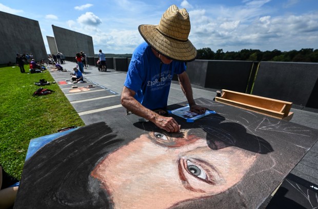 Chalk artist Graham Curtis draws Alan Anthony Beaven, a passenger aboard Flight 93, during a live chalk art event at the Flight 93 National Memorial in Shanksville, PA, on Wednesday, September 9, 2026. Twenty chalk artists from across the country drew portraits of passengers and crew along the flight path of Flight 93. (Photo by Jeff Gritchen, Orange County Register/SCNG)