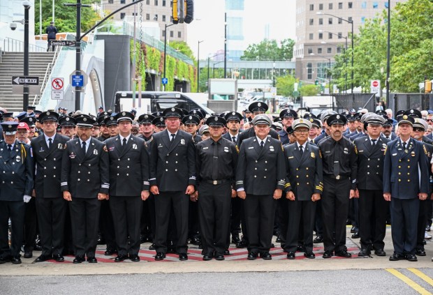 LAFD firefighters stand during a moment of silence near of FDNY Ladder Company 10 and Engine Company near Ground Zero in New York, NY, on September 11, 2026. (Photo by Jeff Gritchen, Orange County Register/SCNG)