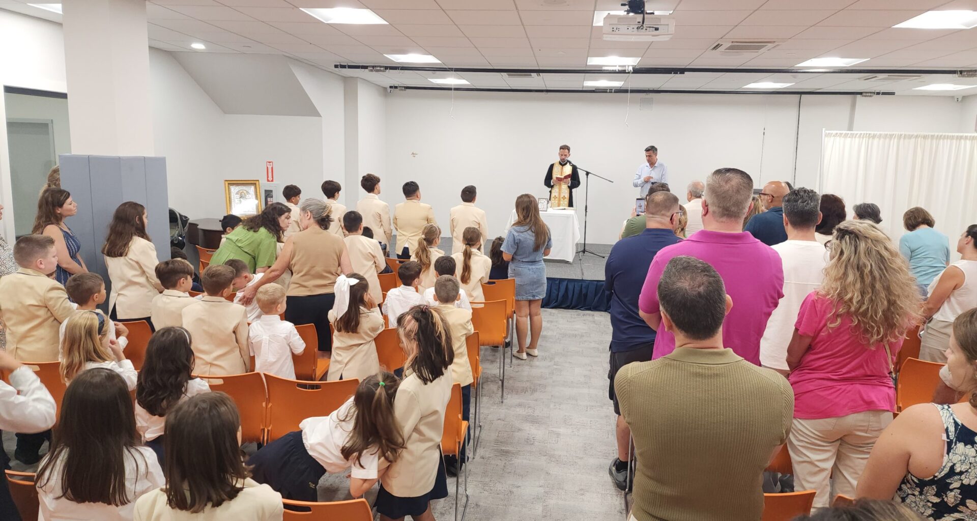 Fr. Michael Gavris performs the blessing of the waters servie in the presence of students, teachers, the school board, and parents. (Photo: The National Herald/Michael Kakias)