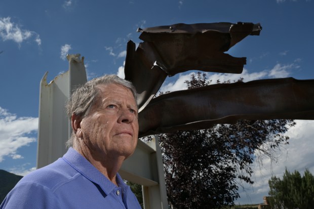 Don Addy poses for a portrait in front of a sculpture that contains steel from the World Trade Center at Fort Carson in Colorado Springs on Tuesday, Sept. 8, 2026. (Photo by Hyoung Chang/The Denver Post)