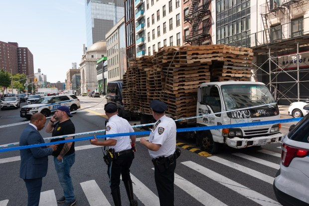 Police investigate after multiple pedestrians were struck by a truck on Canal St. and the Bowery in Manhattan on Thursday. 