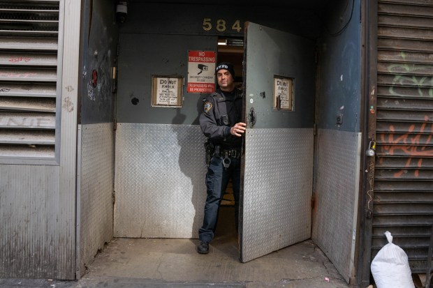 Police investigate after Sidarius Davis was shot in the head inside a music studio on 8th Ave. in Manhattan on Friday, March 8, 2024. (Theodore Parisienne for New York Daily News)