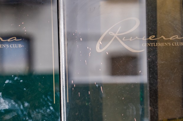 Blood is pictured splattered on a glass door after a 45-year-old man was fatally shot at Riviera Gentleman's Club on Steinway St. near 34th Ave. in Astoria, Queens, on Thursday, Sept. 24, 2026. (Theodore Parisienne / New York Daily News)