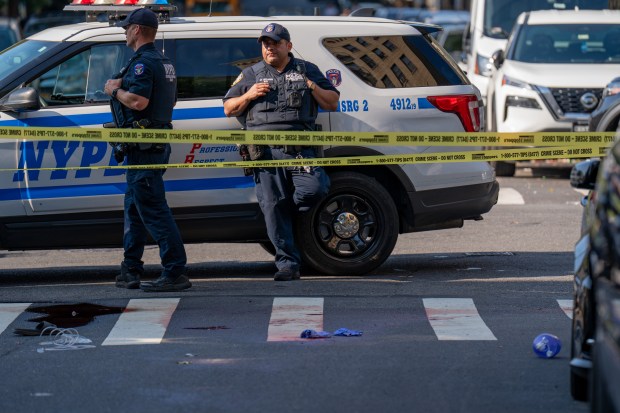 A man, whom a worker inside the MeMe Deli and Grocery store characterized as being drunk and arguing with people inside the store, was pronounced dead at Lincoln Hospital after a vehicle drove over him when he left the store and laid down in the crosswalk on College Avenue at East 166th Street and refused to get up, whereupon he was subsequently struck by a white BMW sedan as it traveled eastbound on East 166th Street, possibly turning northbound onto College Avenue, followed by a marked NYPD RMP that was also traveling eastbound on East 166th Street and also possibly turning left to head northbound on College Avenue in the Bronx on Saturday August 8, 2026. 0917. The BMW then fled the scene. (Theodore Parisienne / New York Daily News)