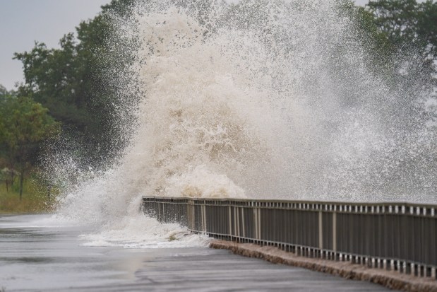 Sea water rushes over the seawall and onto the pedestrian walkway just east of the Verrazzano Bridge in Brooklyn on Saturday, September 26, 2026. (Theodore Parisienne / New York Daily News)