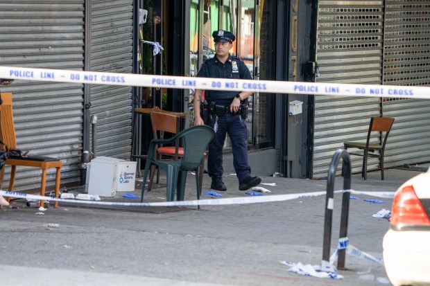 Police investigate the gang-related mass shooting at Taste of the City Lounge on Franklin Ave. in Crown Heights on Aug. 17, 2025.