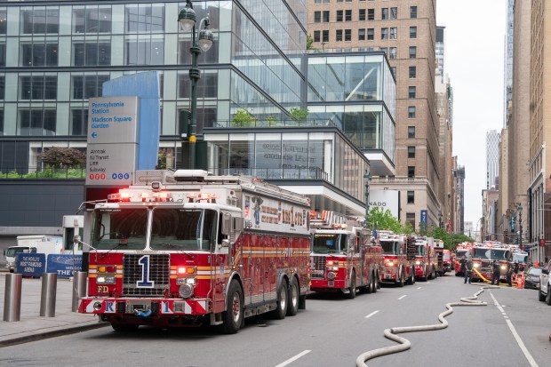 FDNY fire trucks are pictured outside Penn Station in Manhattan amid a two-alarm fire in the East River Tunnel between Manhattan and Queens on Thursday, May 14, 2026. (Barry Williams / New York Daily News)