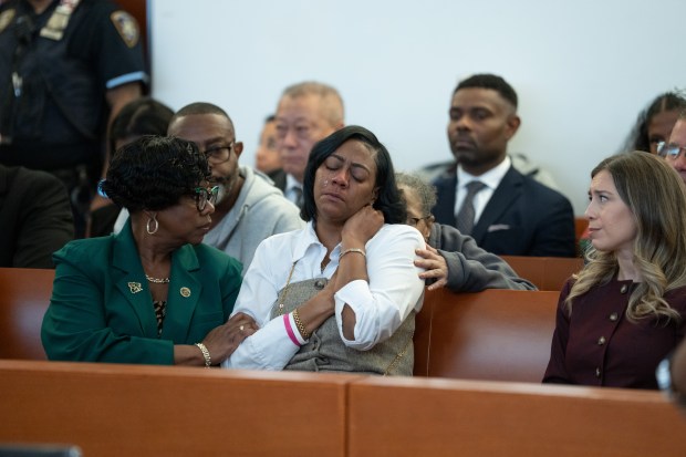 Lynette Pierce (center), the MTA subway conductor that Isaiah Thompson slashed is pictured in Bronx Criminal Court during Thompson's sentencing on Tuesday, September 22, 2026. Bronx DA Darcel Clark is pictured at left. (Barry Williams / New York Daily News)