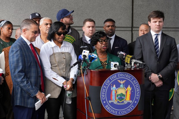 Bronx DA Darcel Clark speaks during a press conference after Isaiah Thompson was sentenced in Bronx Criminal Court for attacking MTA subway conductor Lynette Pierce (in sunglasses at left) on Tuesday, Sept. 22, 2026. (Barry Williams / New York Daily News)