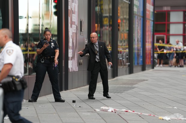 A woman was shot by NYPD cops after refusing to drop two knives she was swinging as she approached them in Times Square Monday, Aug. 31, 2026, at Seventh Ave. and W. 43rd St. in Midtown Manhattan. (Barry Williams / New York Daily News)