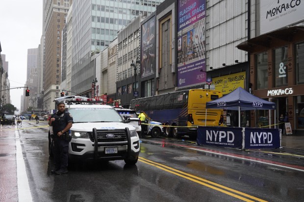 Police investigate after a bicyclist was killed in a collision with a dump truck on West 34th St. in Manhattan on Monday.