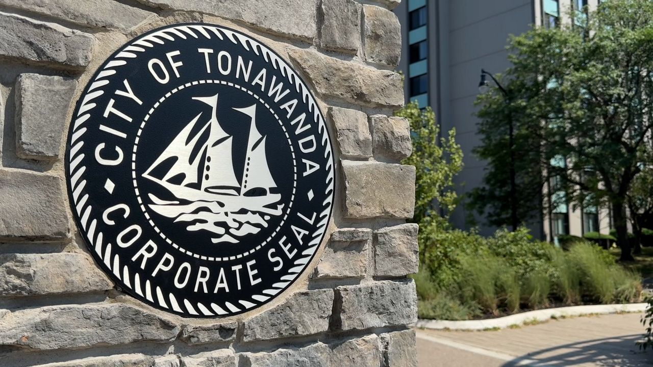 town of tonawanda seal on a stone wall