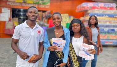 The pageant contestants pause to pose with fans at a local market as they drum up interest in HPV vaccination. Credit: Tina S. Mehnpaine