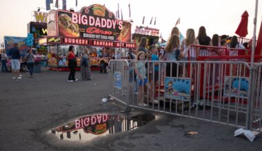 Fairgoers wait in line at the New York State Fair.