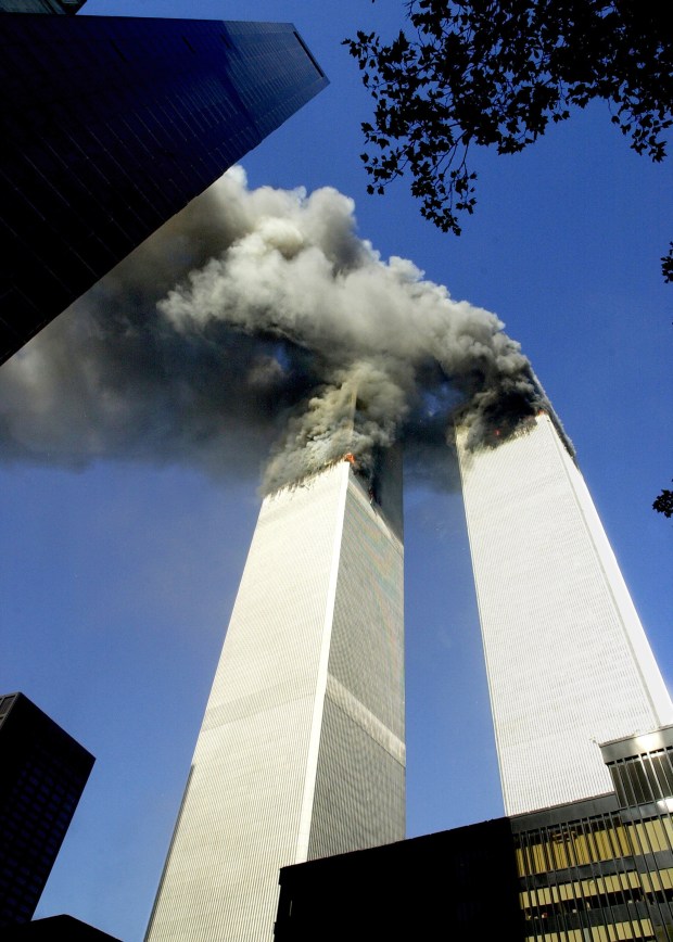 Smoke billows from the twin towers of the World Trade Center after a terrorist attack on Sept. 11, 2001. (Susan Watts / New York Daily News)