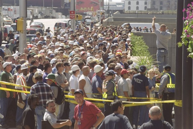 Volunteers line up to assist in the search and rescue efforts outside the Jacob Javits Center in Manhattan on Sept. 13, 2001. (Michael Appleton / New York Daily News)
