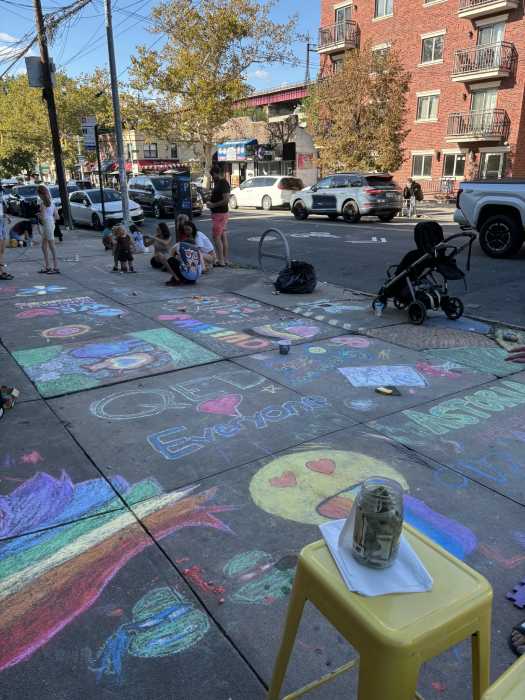 Q.E.D. hosted a "sidewalk chalkathon" in response to the repeated erasure of the notices. Photo via Hannah Lieberman.