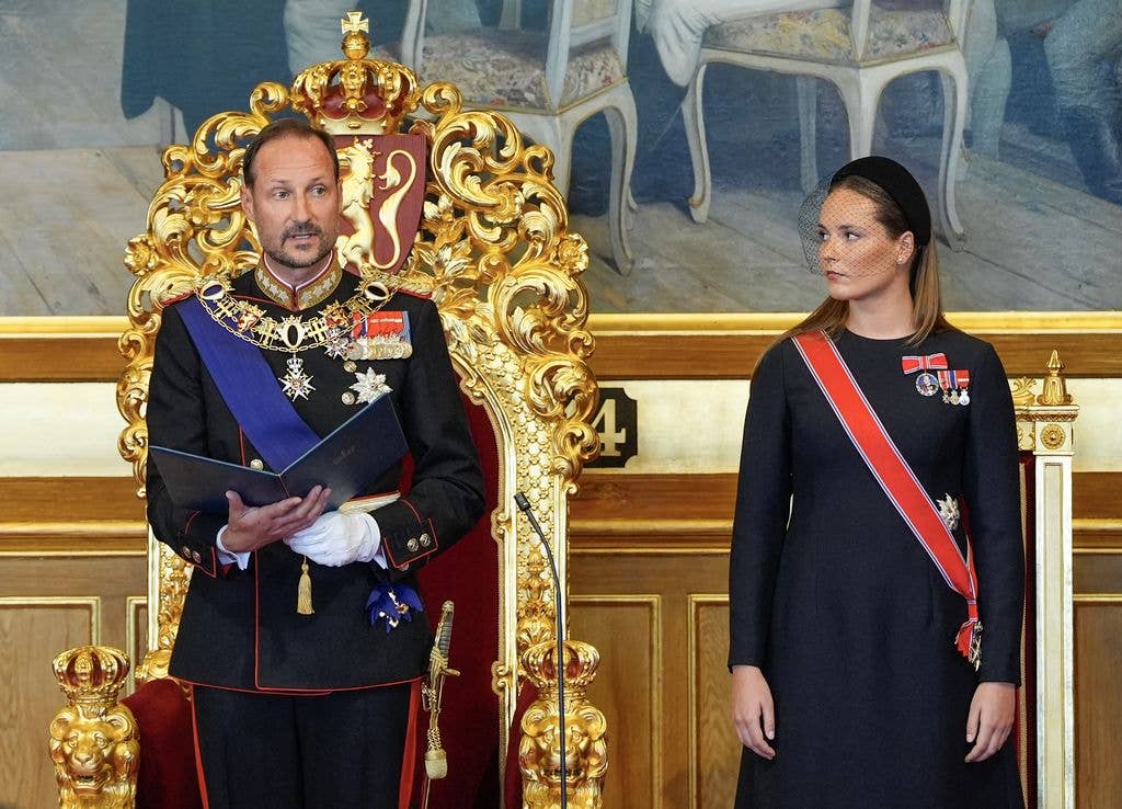 King Haakon VIII of Norway takes the oath as his daughter Crown Princess Ingrid Alexandra of Norway looks on 