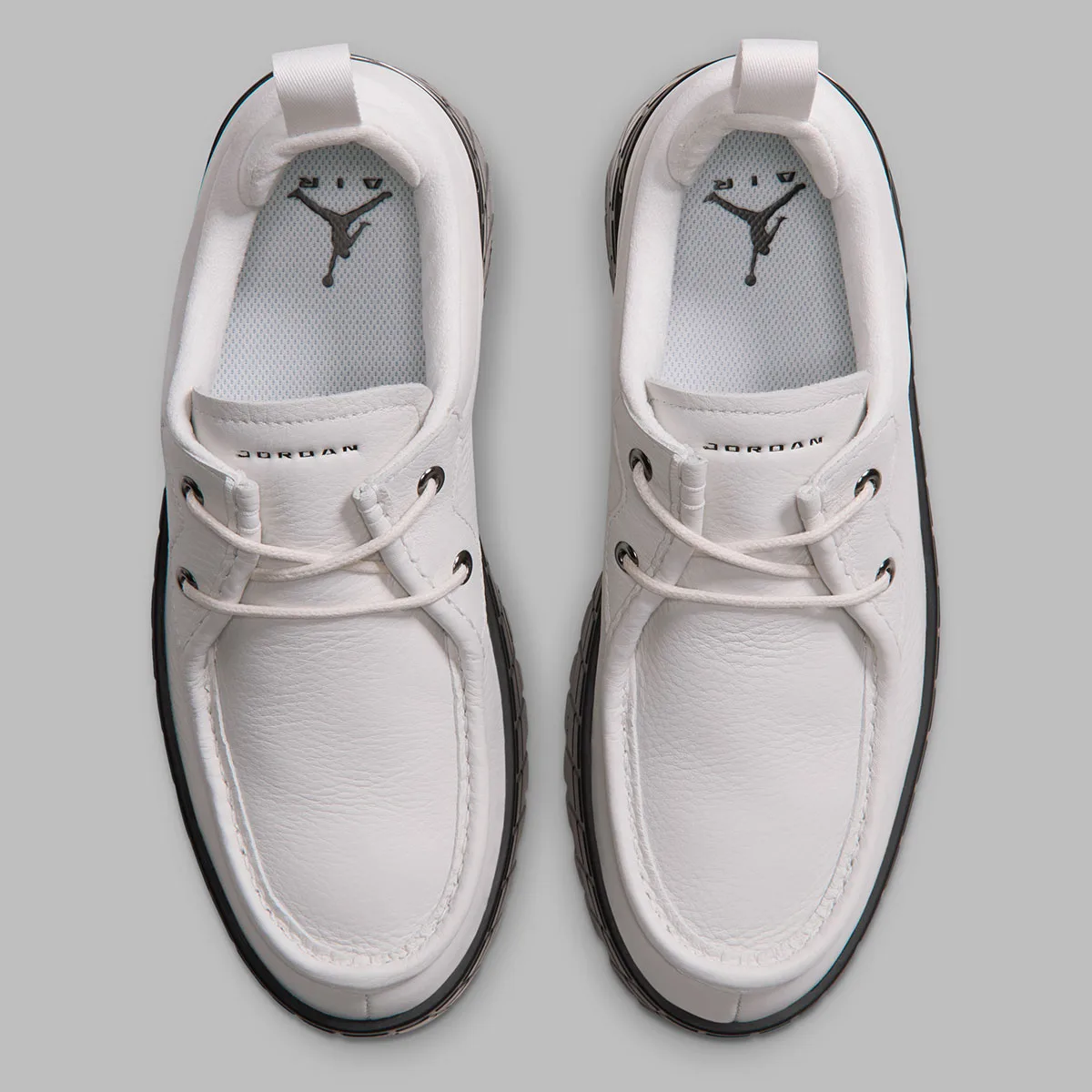 top-down pair, white uppers, jumpman air logo on insole and jordan text on tongue, Jordan 1 Brooklyn