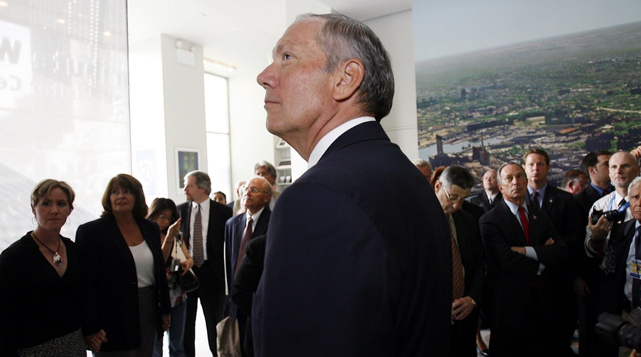 New York Gov. George Pataki looks at one of the exhibits in the new Tribute WTC Visitor Center, Wednesday, Sept 6, 2006, in New York. (AP Photo/Seth Wenig)