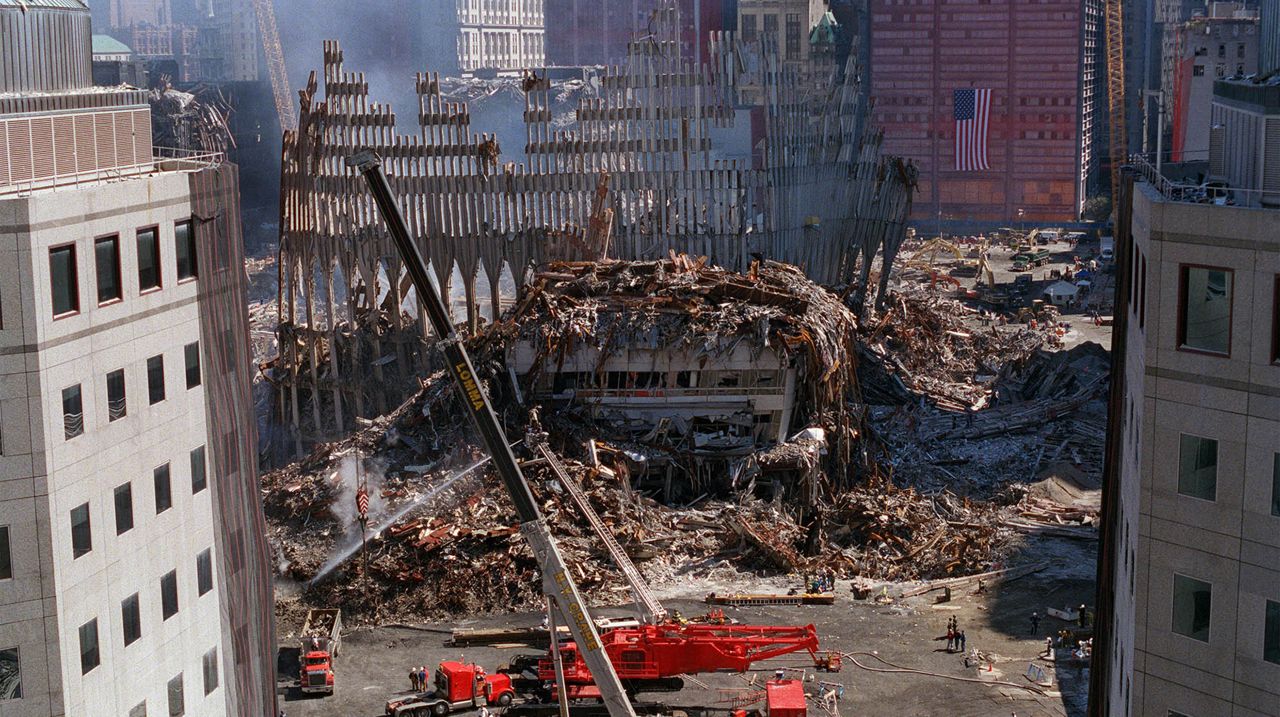 Two large cranes are positioned near the rubble of the World Trade Center in New York, on Wednesday, Sept. 26, 2001. Work continues around the clock to recover the remains of those who died in the destruction of the 110-story towers on Sept. 11.
