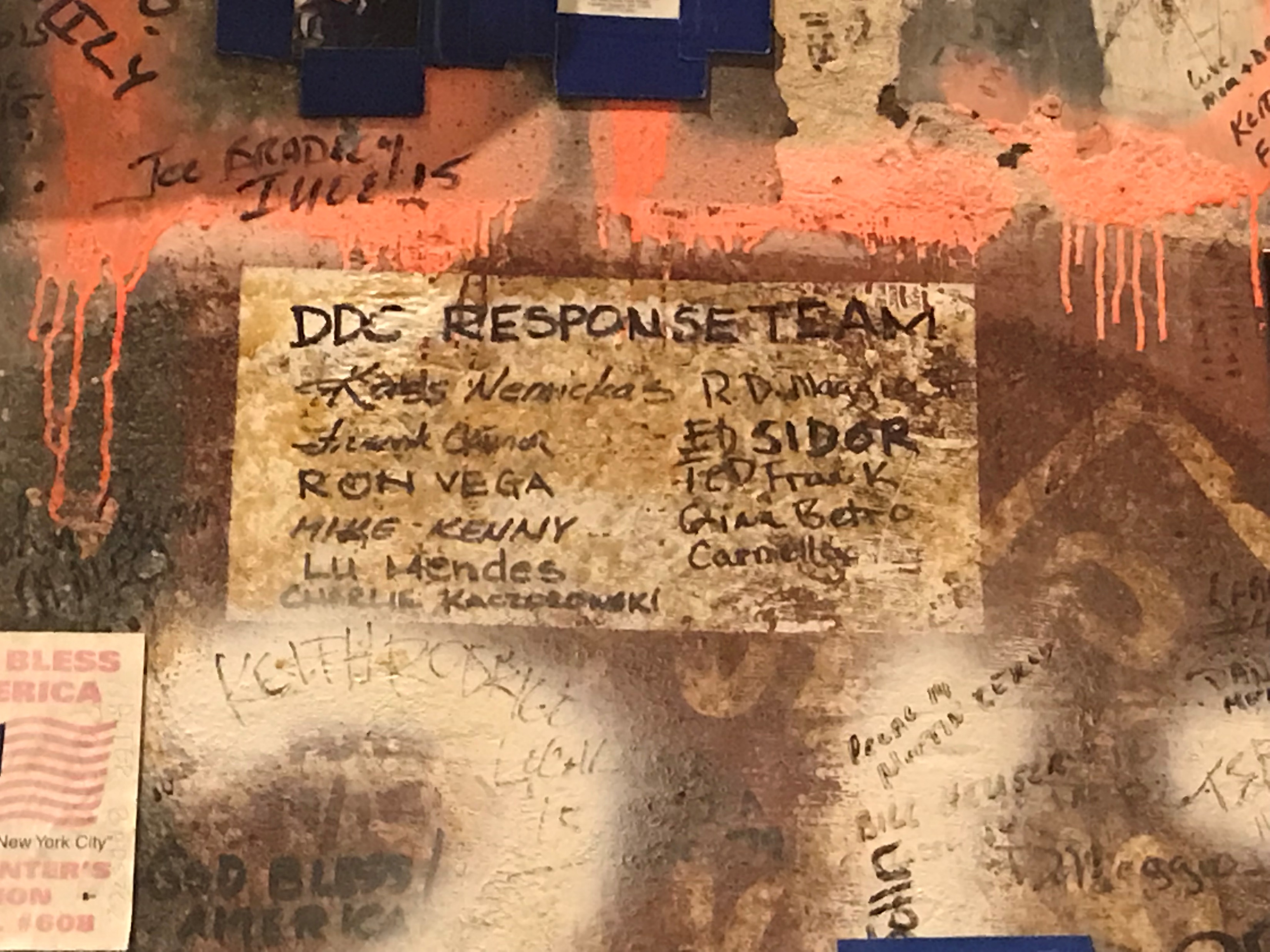 Some graffiti at Ground Zero listing names of the DDC response team. 