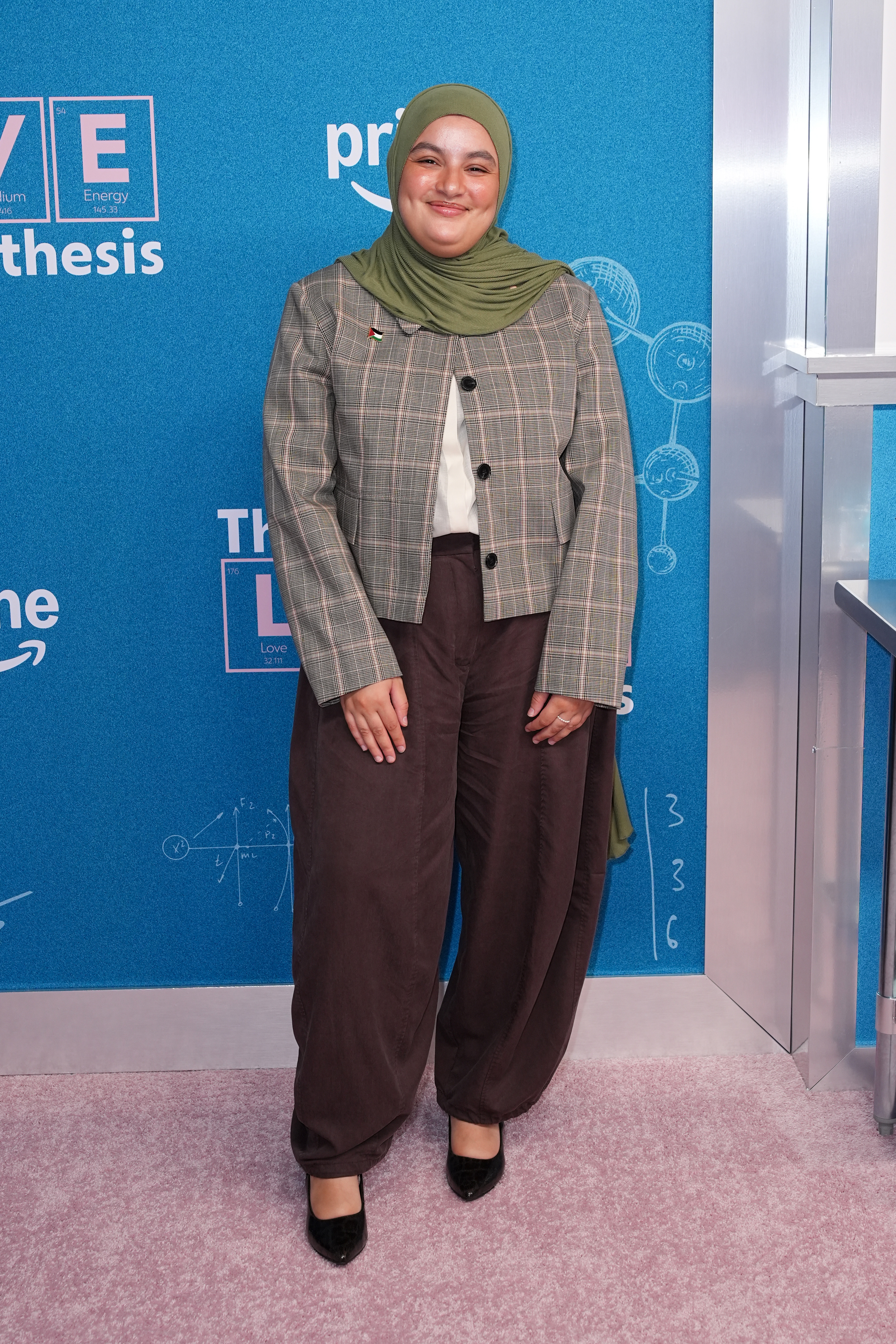 Ayman Chaudhary smiling at "The Love Hypothesis" New York Premiere.