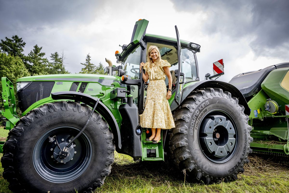 The Dutch Queen took a hands-on approach to the royal engagement, driving a tractor while learning about fiber hemp and its role in sustainable construction.