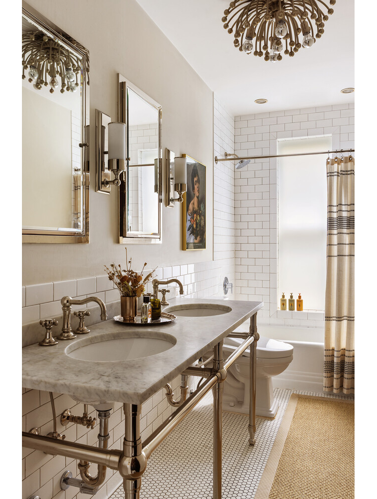 bathroom with double vanity, white fixtures