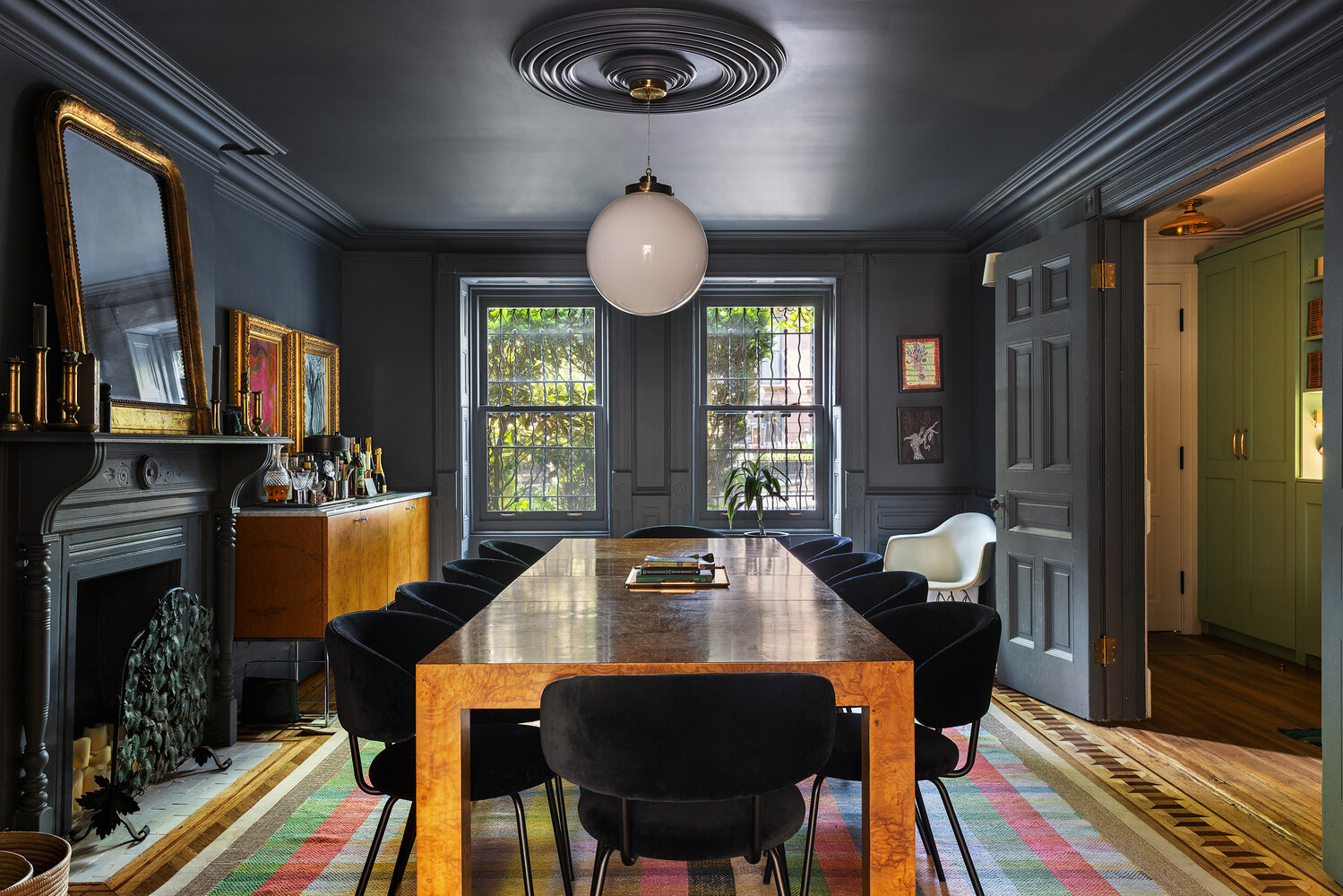 dining room with dark blue walls and ceiling