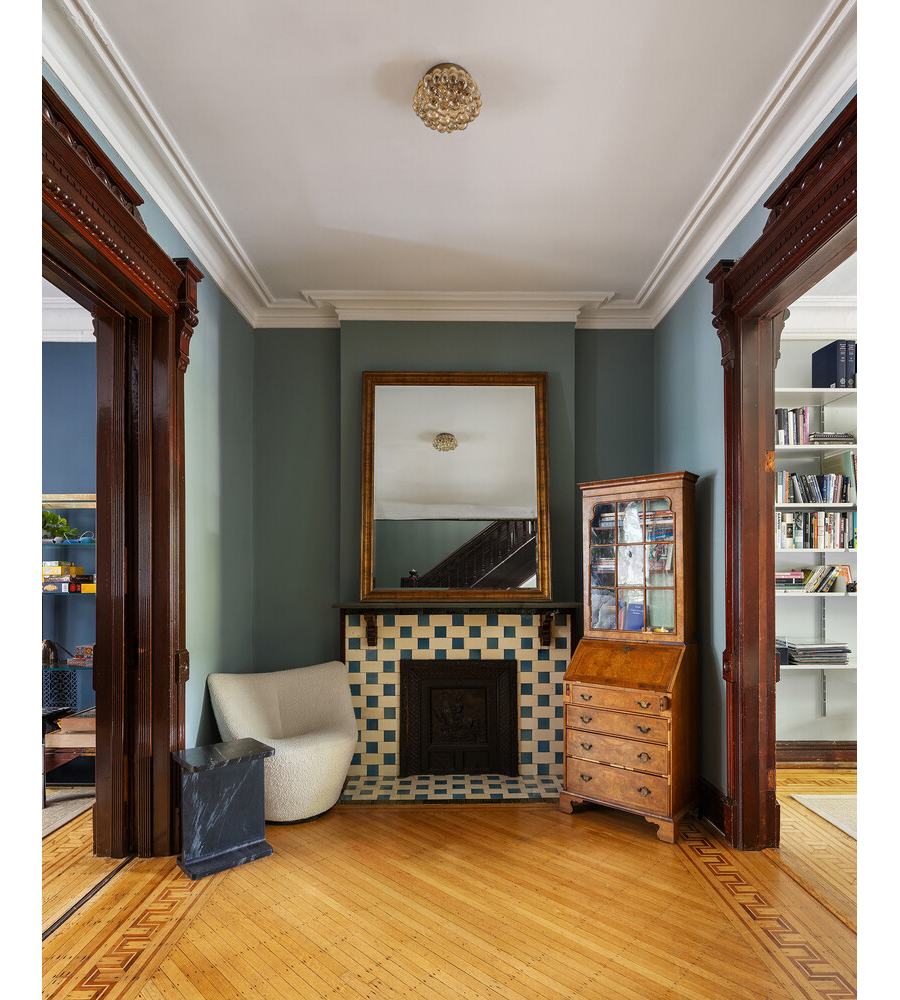 middle parlor with modern tile around a mantel