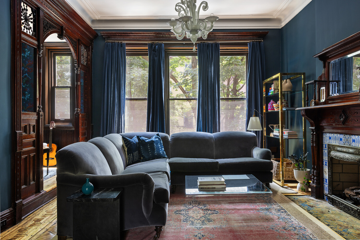 rear parlor with dark blue walls, fretwork,