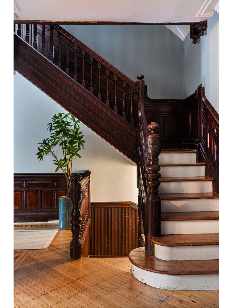 stair with wainscoting, newel post