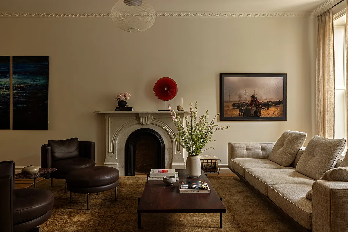 brooklyn parlor with marble mantel and moody lighting