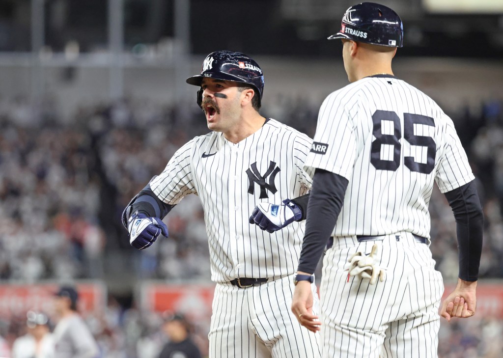 New York Yankees catcher Austin Wells (28) celebrates after hitting an RBI single against the Boston Red Sox at Yankee Stadium.