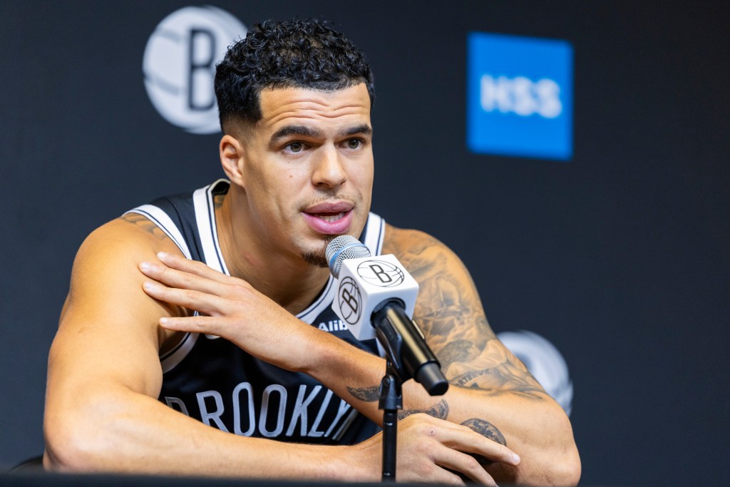 Michael Porter Jr. speaks into a microphone at Brooklyn Nets Media Day.