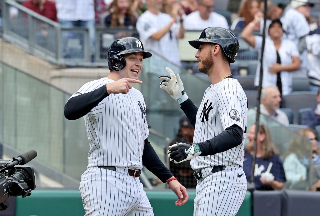 Yankees left fielder Cody Bellinger (35) celebrates with designated hitter Ben Rice (22) after scoring on a two-run home run during the fourth inning of game one of a split doubleheader against the Tampa Bay Rays at Yankee Stadium in the Bronx, N.Y., Tuesday, Sept. 22, 2026.